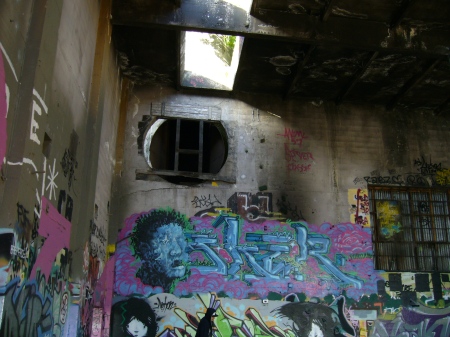 Some of the graffitti inside the main building with smokestack